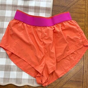 FP Movement by Free People Vibrant Orange Shorts with Pink Band